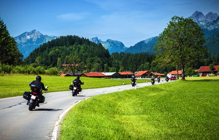 Biker group riding a curving road